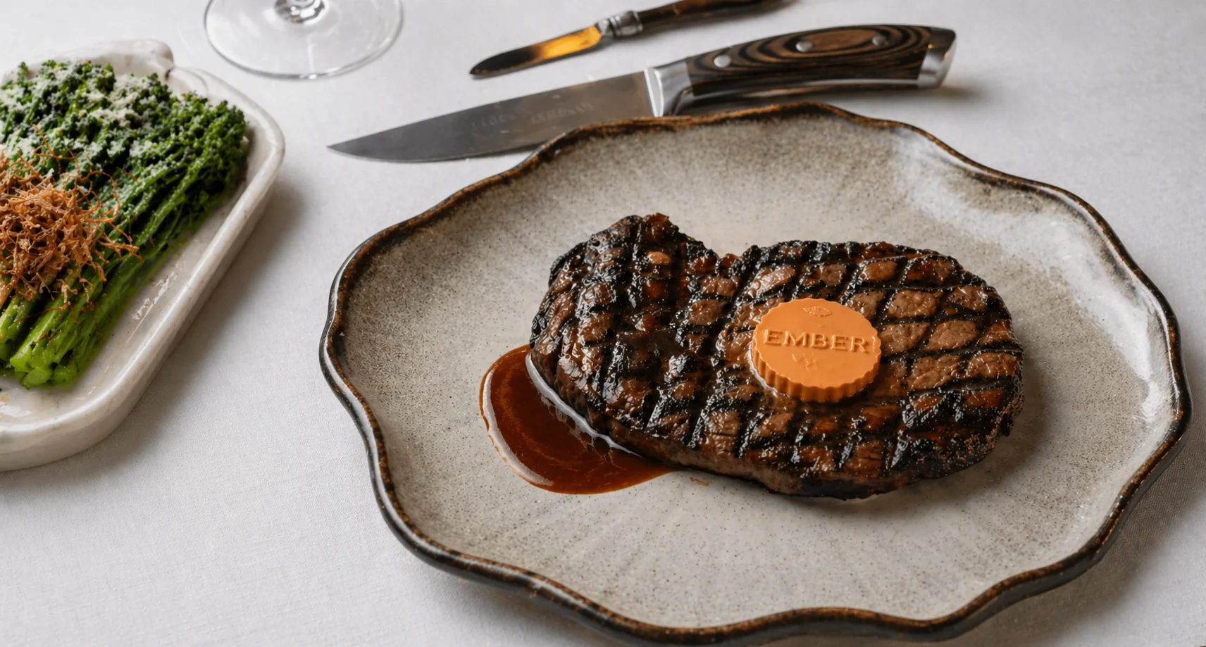 Chef's table at the pass — six seats, eight courses.