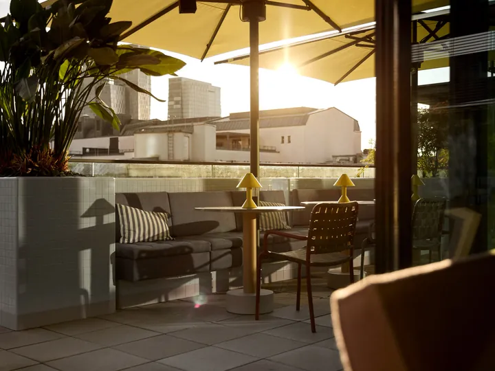The lazuli rooftop terrace at Kimpton Main Frankfurt at golden hour